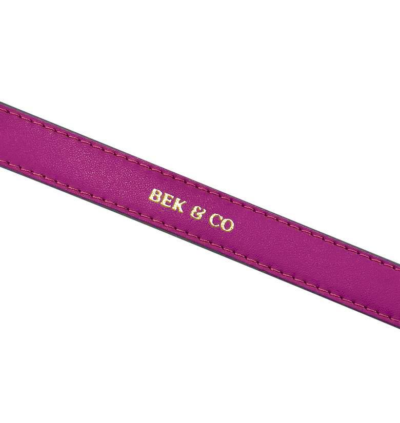 close up view of embossed Bek & Co logo on pink leather dog collar